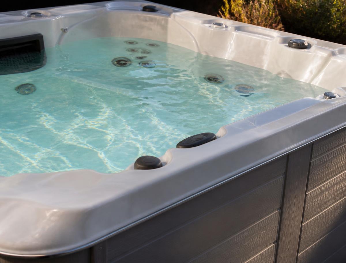 Close view of the acrylic shell, jets and cabinet of a spa